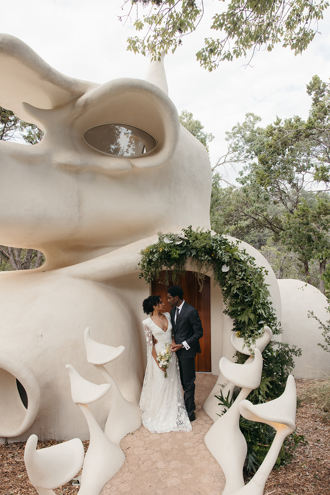 wedding portraits in front of small Austin venue