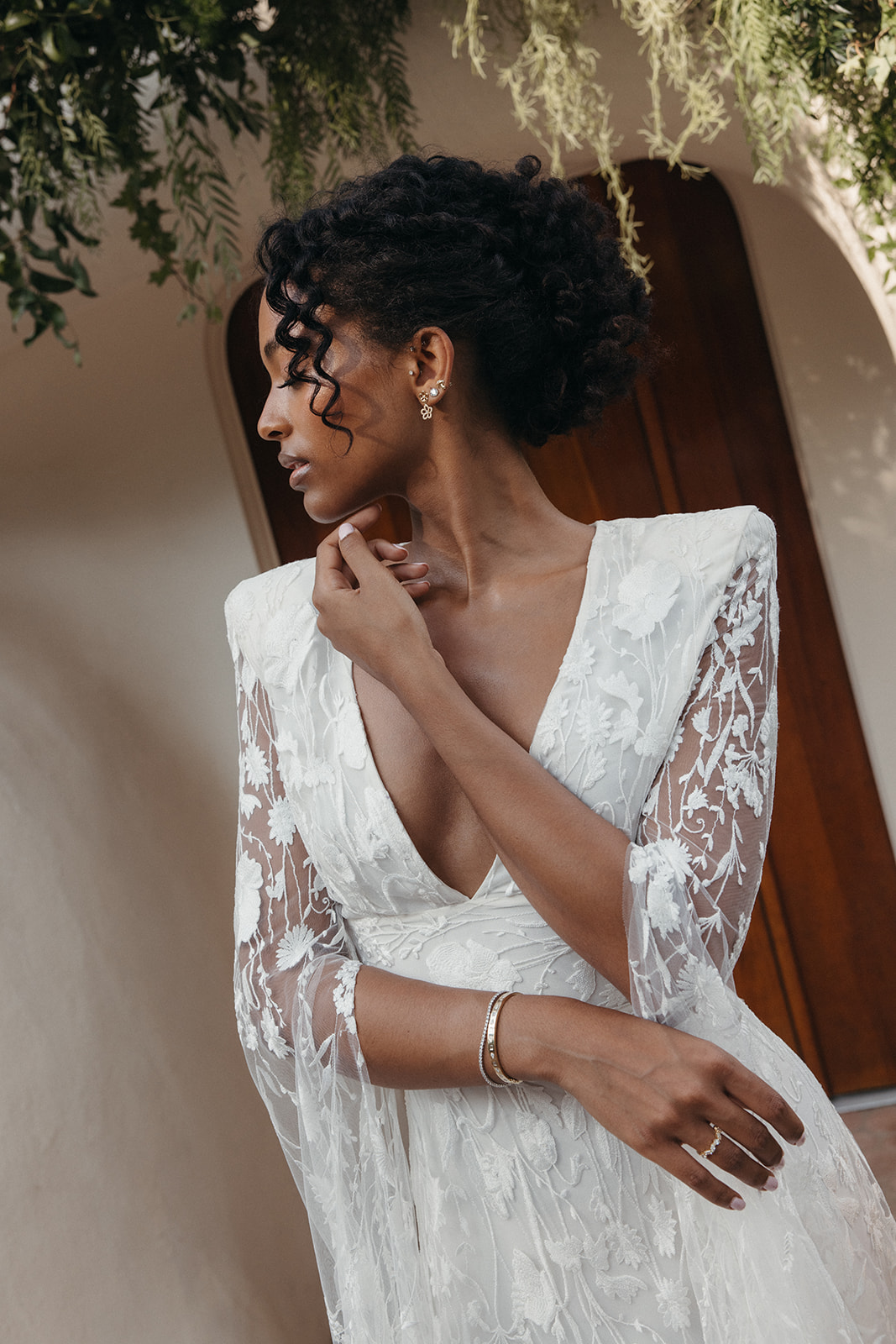 ethereal lace cape wedding dress