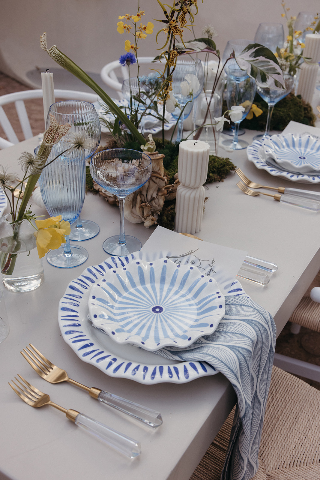 blue and white table settings at wedding