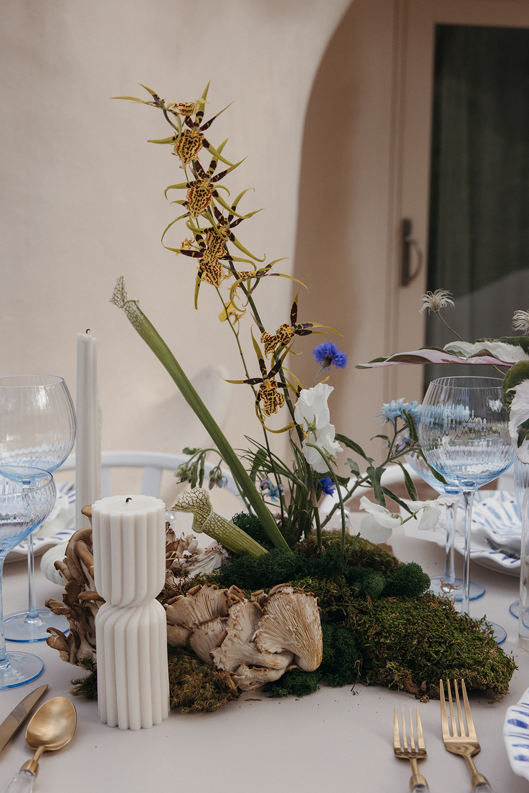 organic wedding candles and mushrooms in floral arrangements