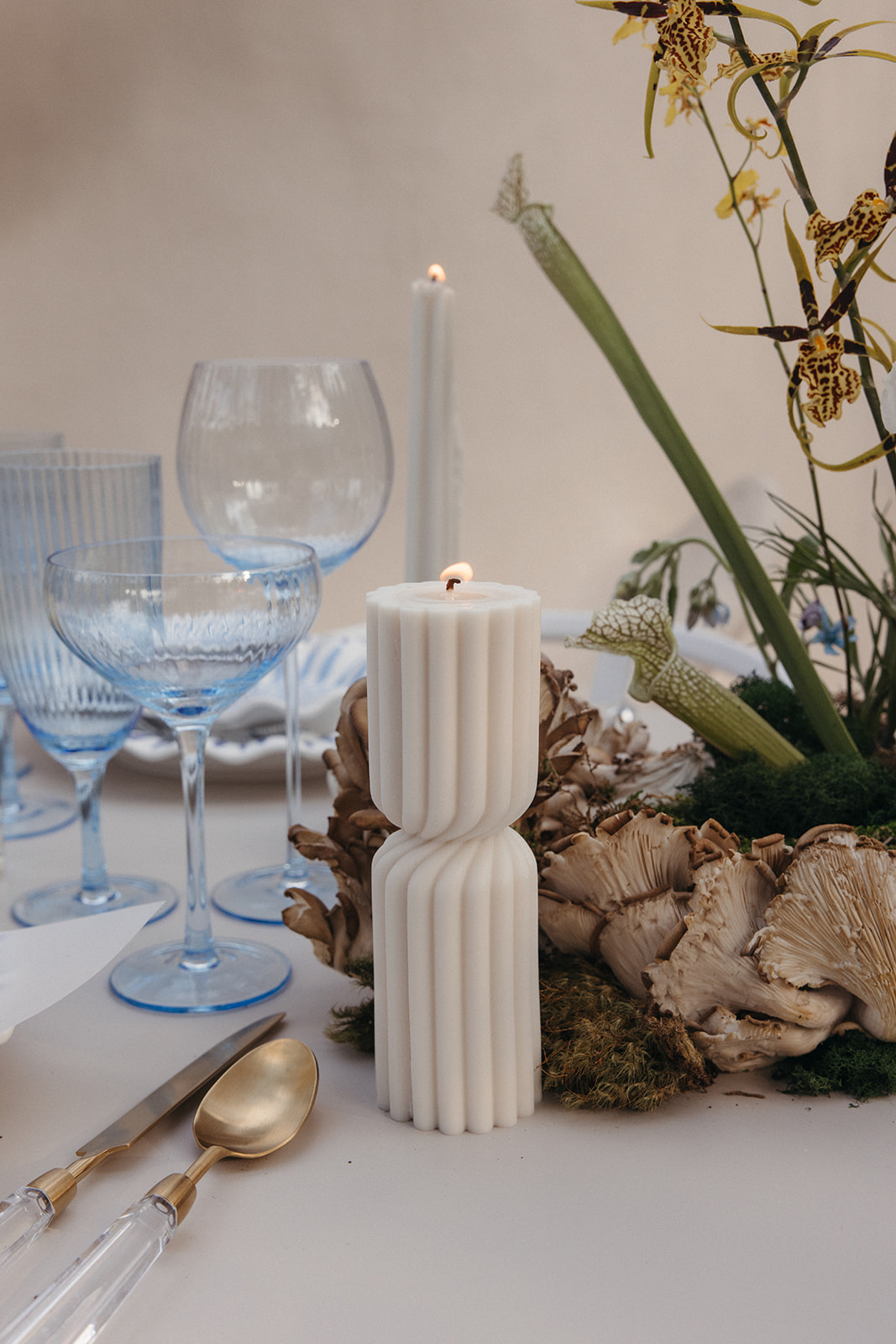 organic wedding candles and mushrooms in floral arrangements