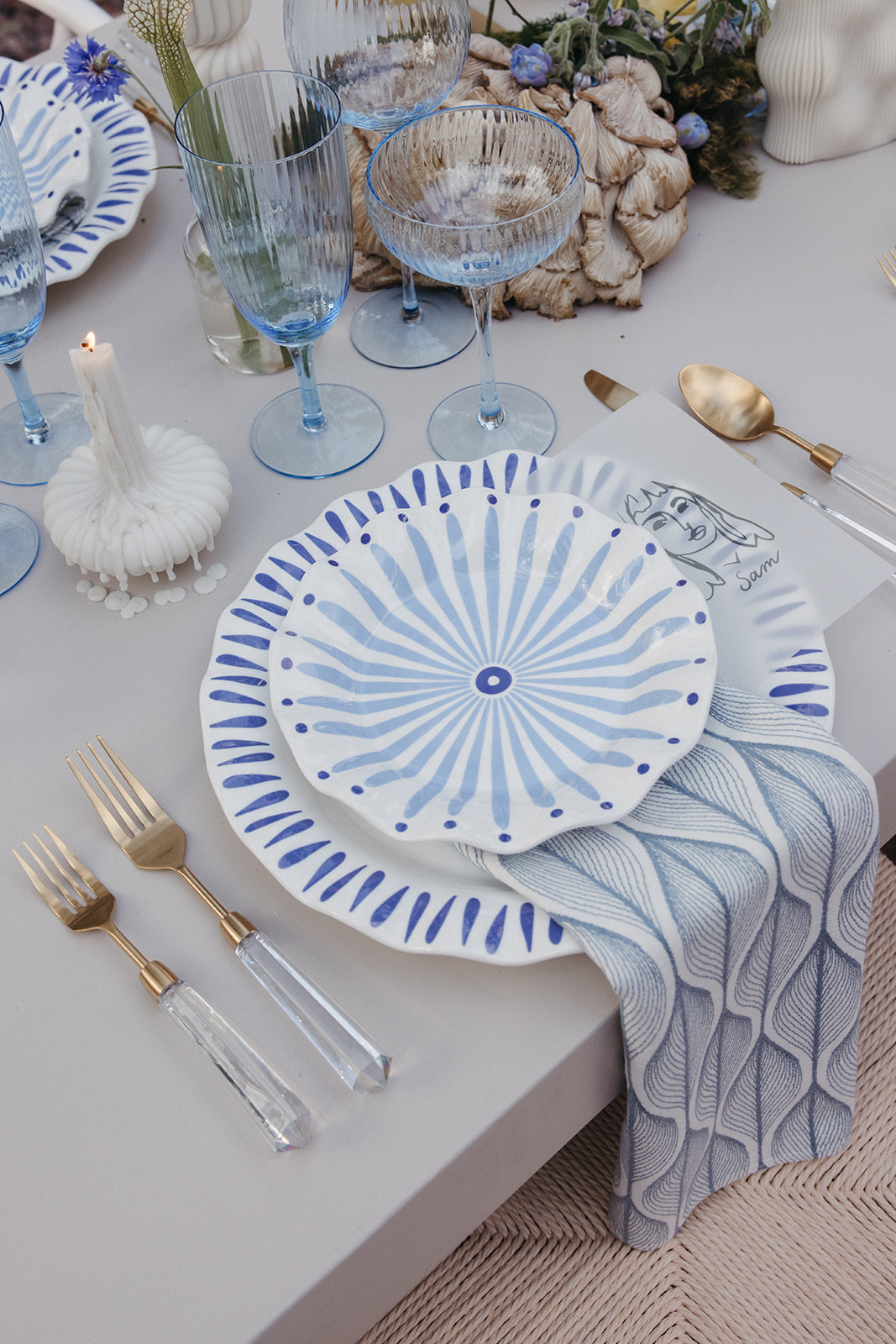 blue and white table settings at wedding