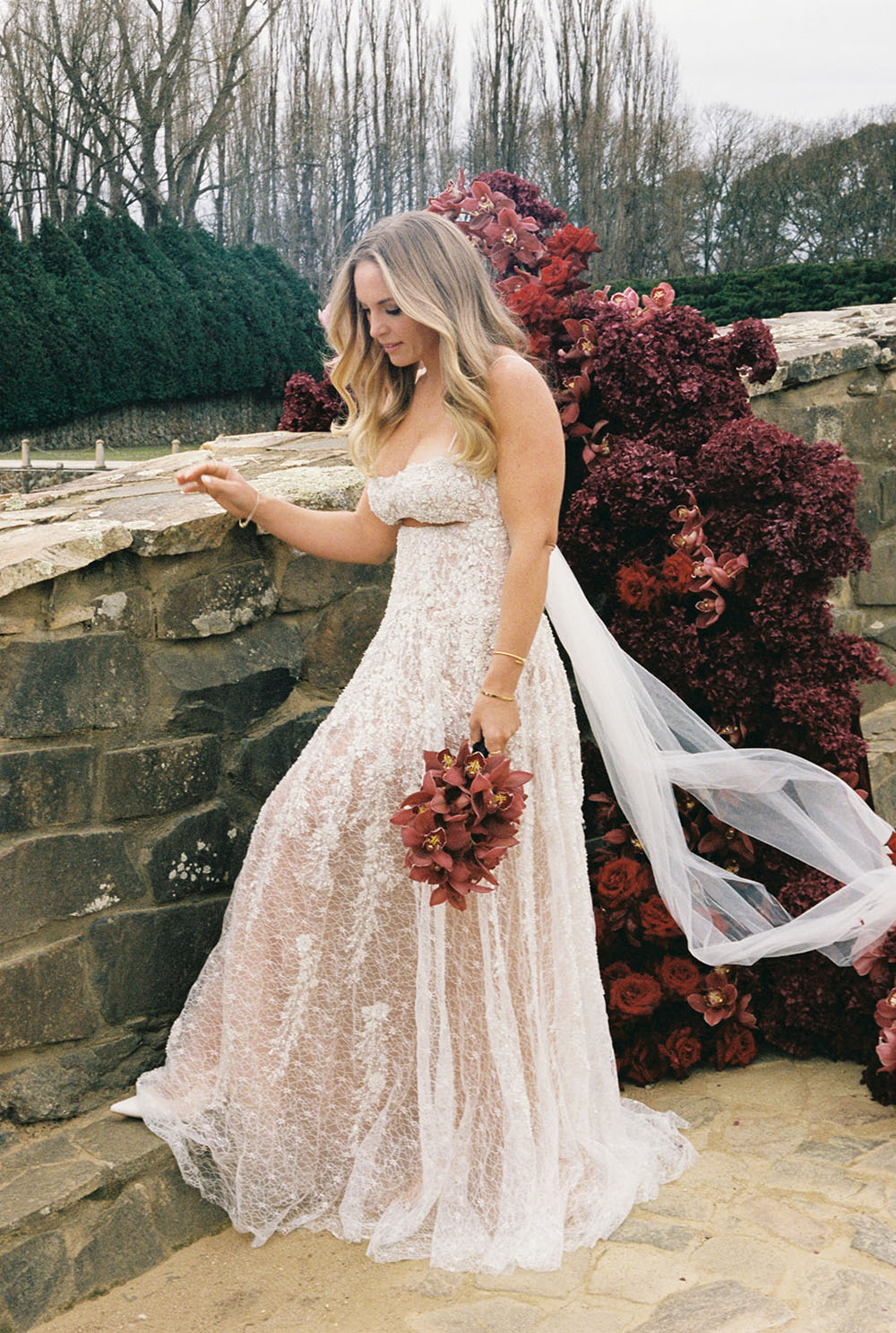 burgundy wedding florals and sparkly wedding dress