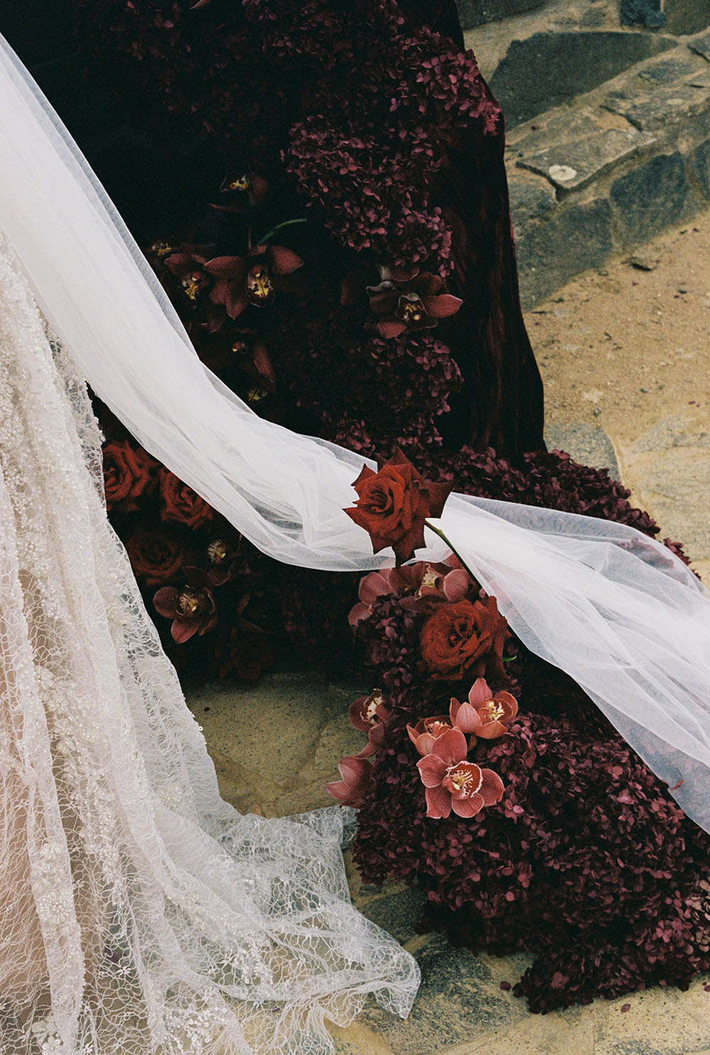 red wedding flowers and sparkly wedding gown by ASTON Bridal