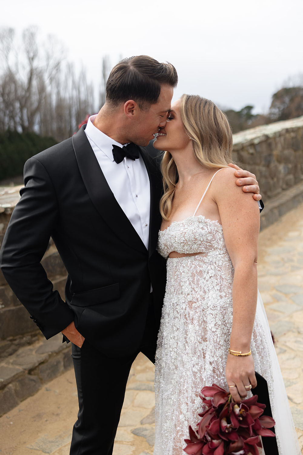 red wedding flowers and sparkly wedding gown by ASTON Bridal