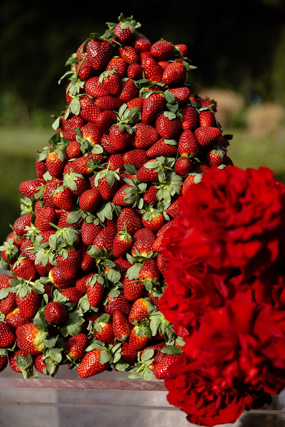 big strawberry covered wedding cake - modern black & red wedding ideas