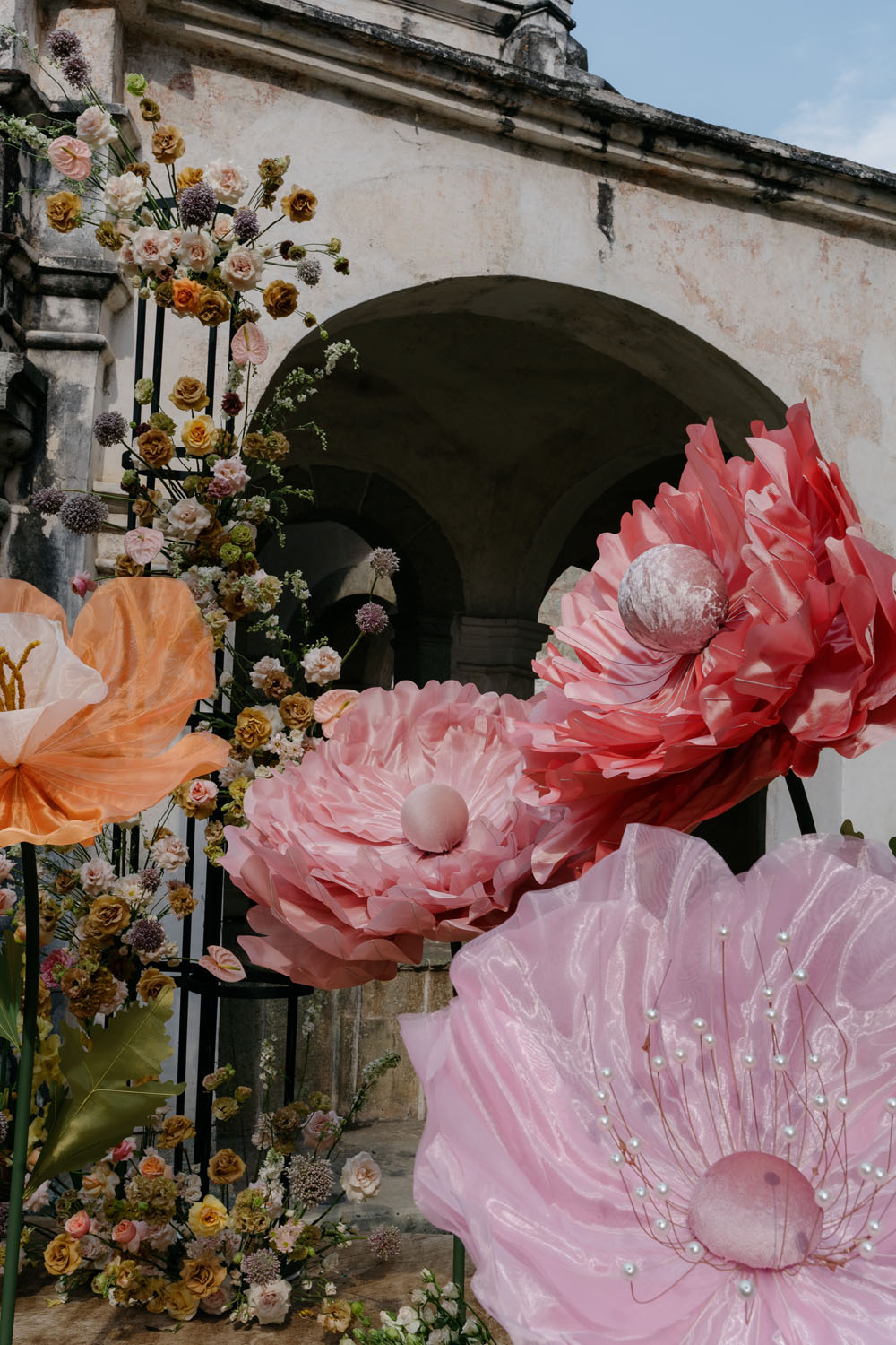 Giant faux flowers at Oaxaca wedding