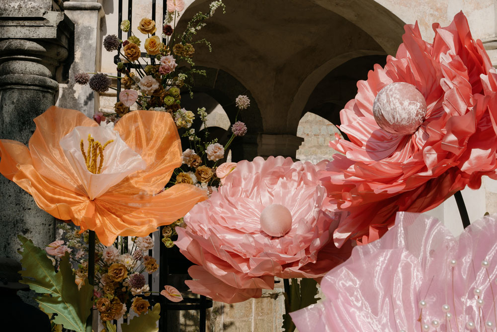 Giant faux flowers at Oaxaca wedding