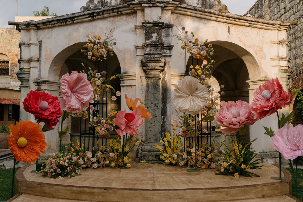 wedding ceremony in mexico with giant fake flowers