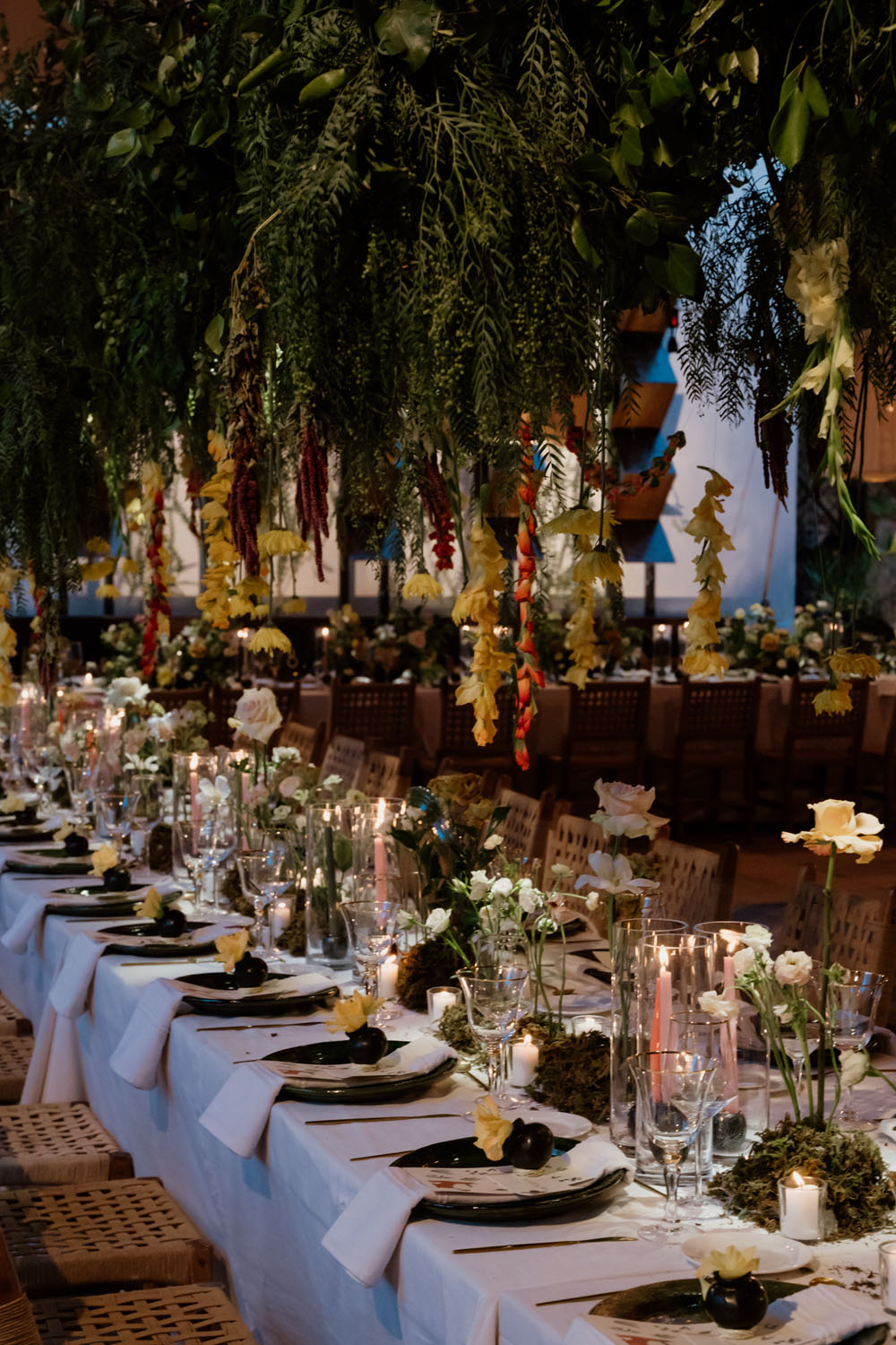 lush floral wedding reception with lantern lights