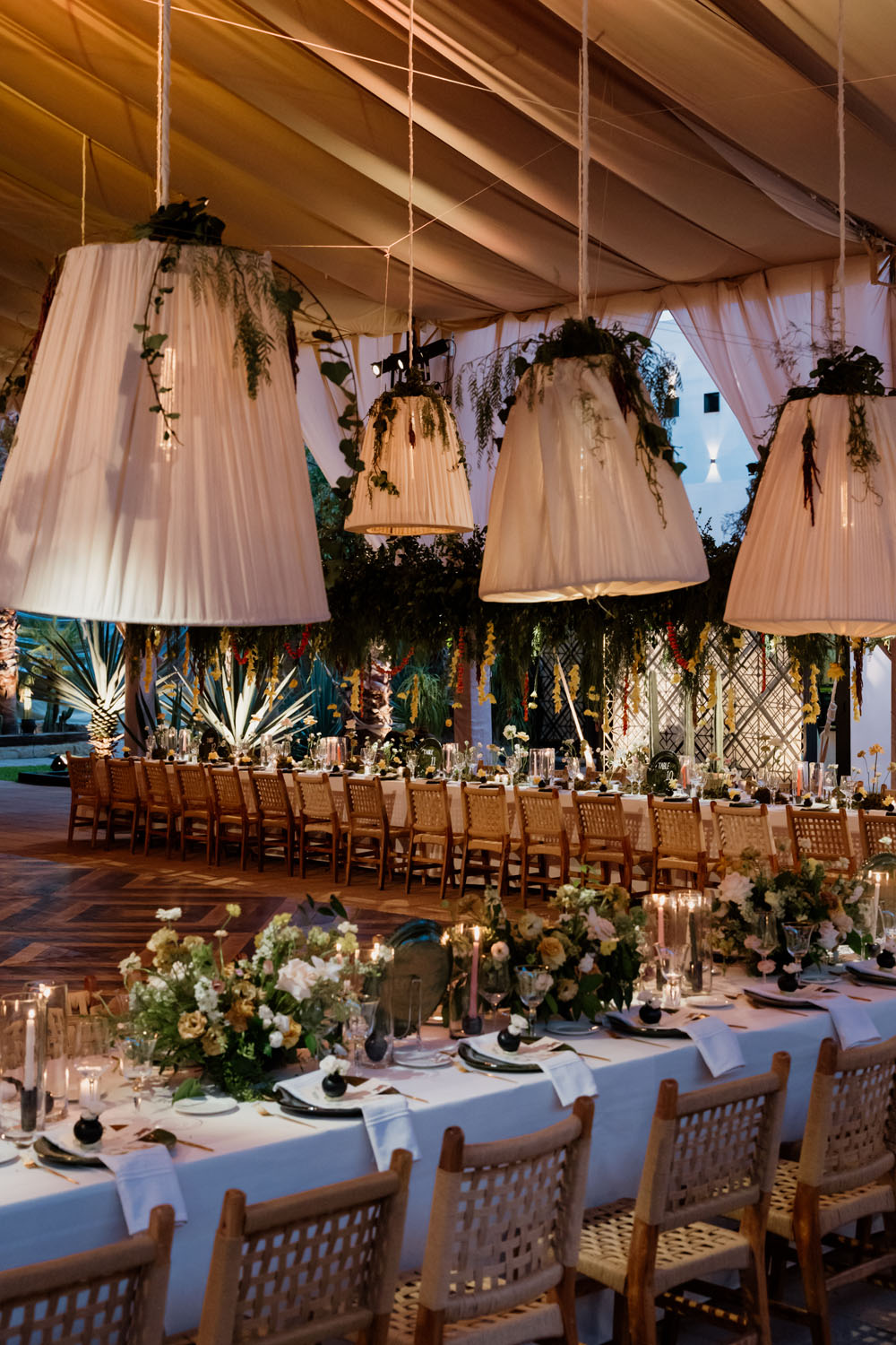 lush floral wedding reception with lantern lights